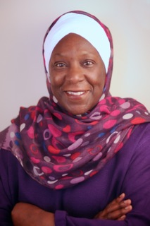Picture of Haneefah Muhammad smiling with arms crossed